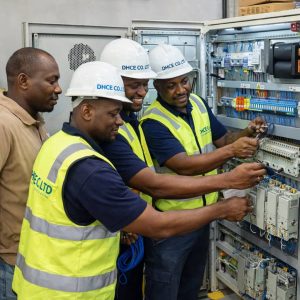 DHCE electrical engineers performing electrical installation and maintenance on power distribution and control systems