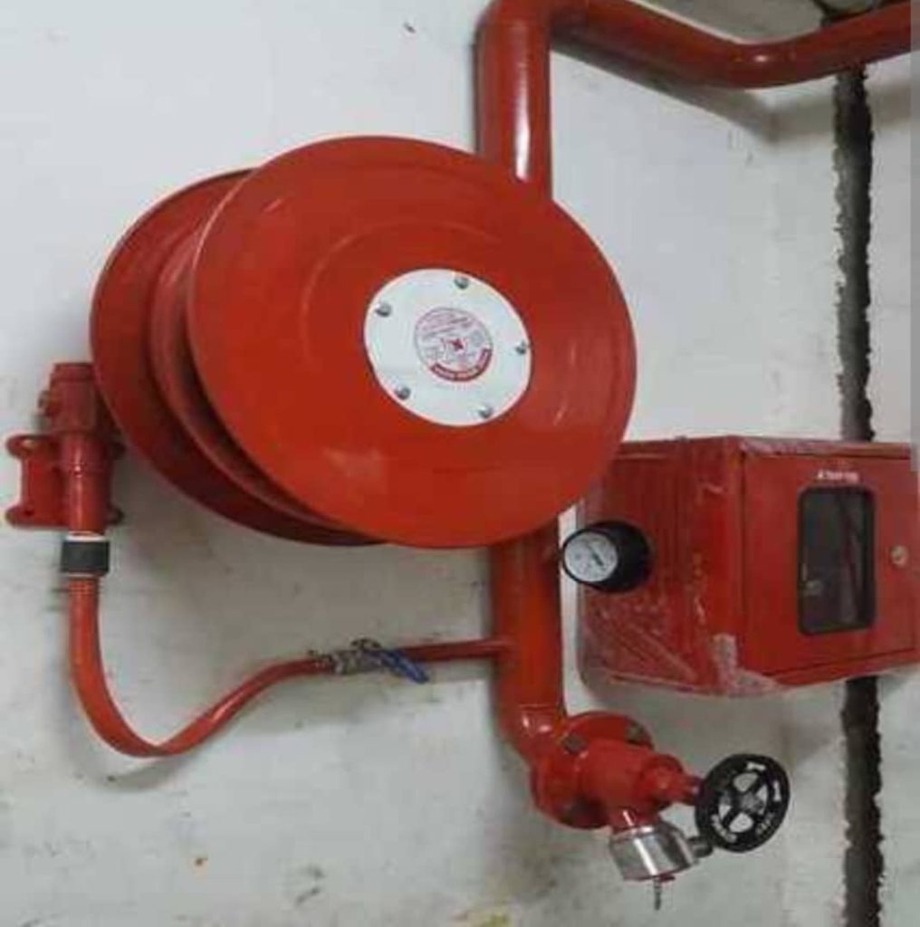 Fire alarm control panel, detectors, and alarm system components installed for building fire safety and protection.