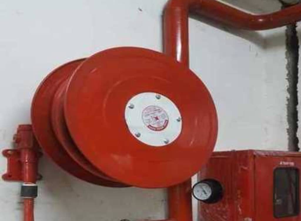 Fire alarm control panel, detectors, and alarm system components installed for building fire safety and protection.